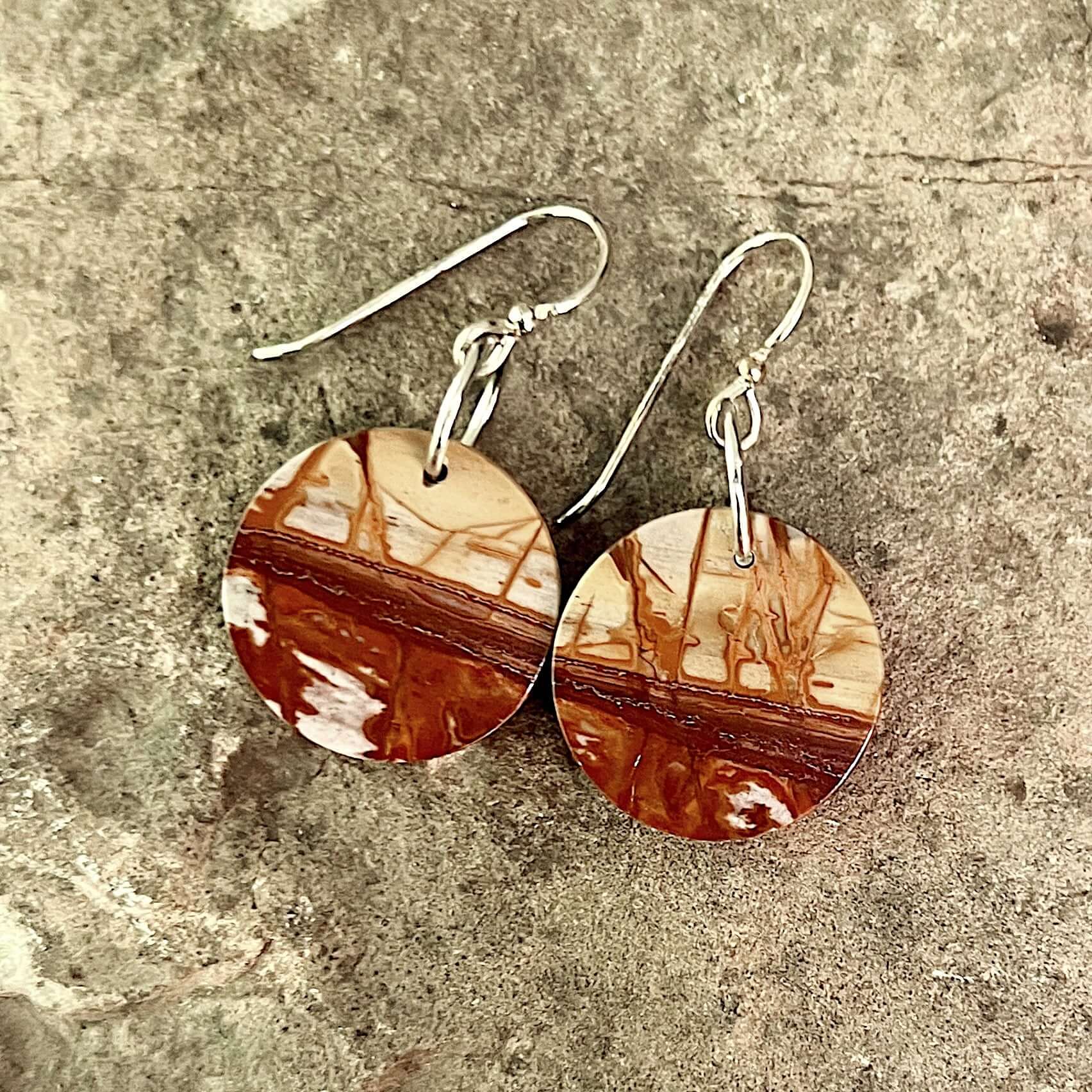 Red Creek Jasper Circle Earrings These earrings are made with high-quality Red Creek Jasper gemstones which bring balancing energy to the wearer. Zodiac Signs: Aries, Scorpio Chakras: Root, Sacral. Handmade with authentic crystals & gemstones in Minneapol