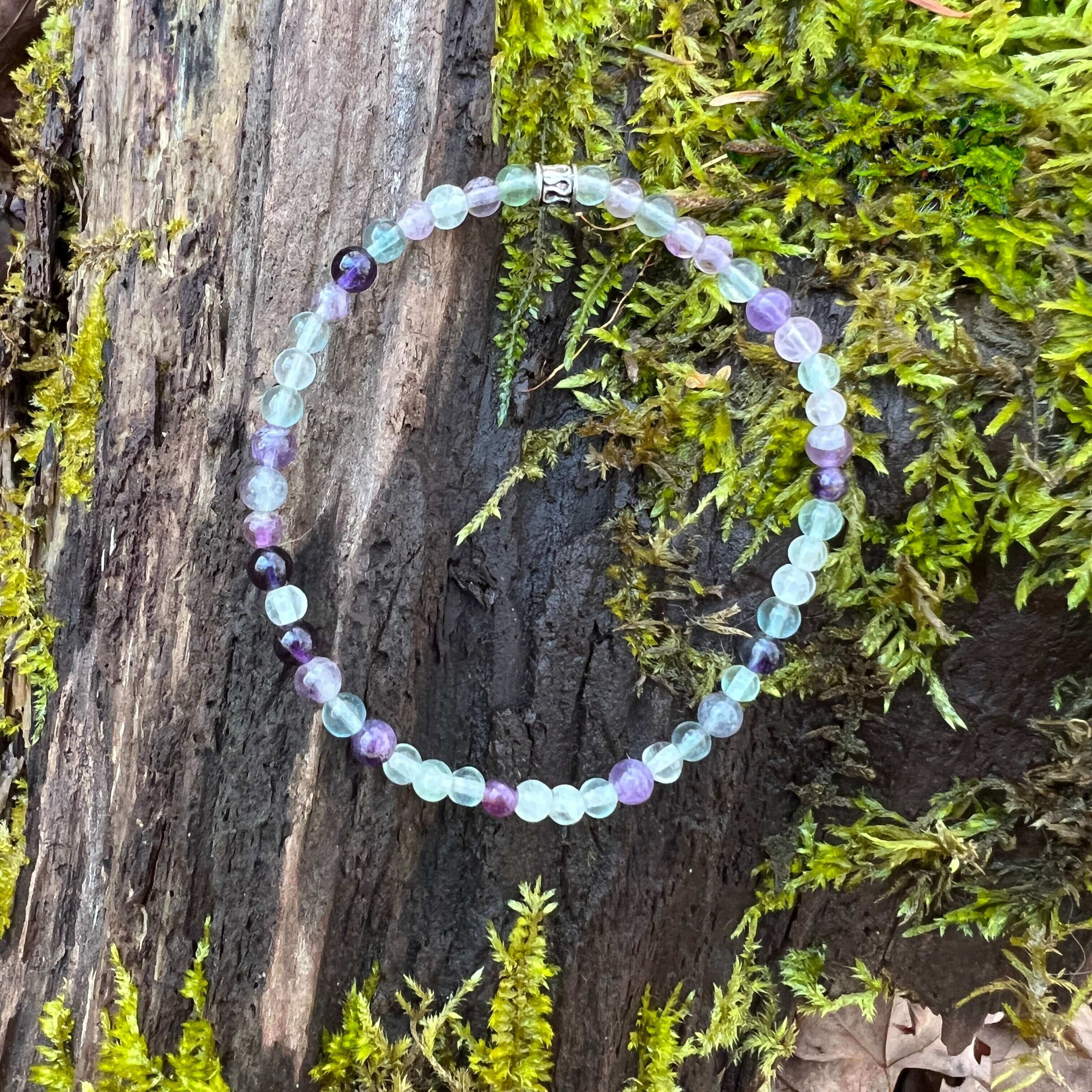 Fluorite and Amethyst Bead Bracelet This bracelet is made with high-quality Fluorite and Amethyst stones which bring stability, protection and awareness to the wearer. Zodiac Sign: Capricorn. Chakra: Heart. Handmade with authentic crystals and gemstones i