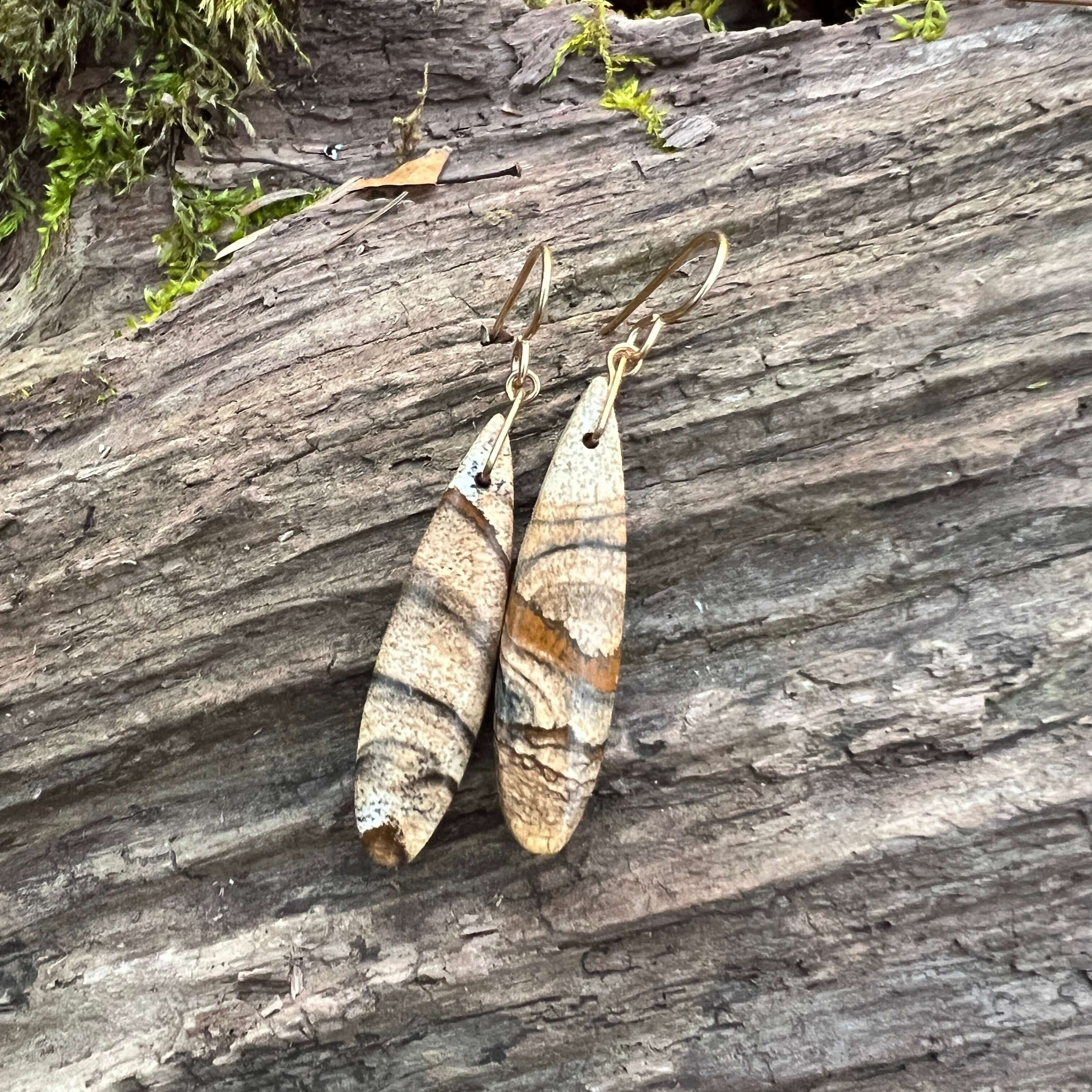 Picture Jasper Earrings These earrings are made with high-quality Picture Jasper gemstones which bring confidence and courage to the wearer. Zodiac Signs: Leo and Capricorn. Chakras: Root and Third Eye. Handmade with authentic crystals & gemstones in Minn