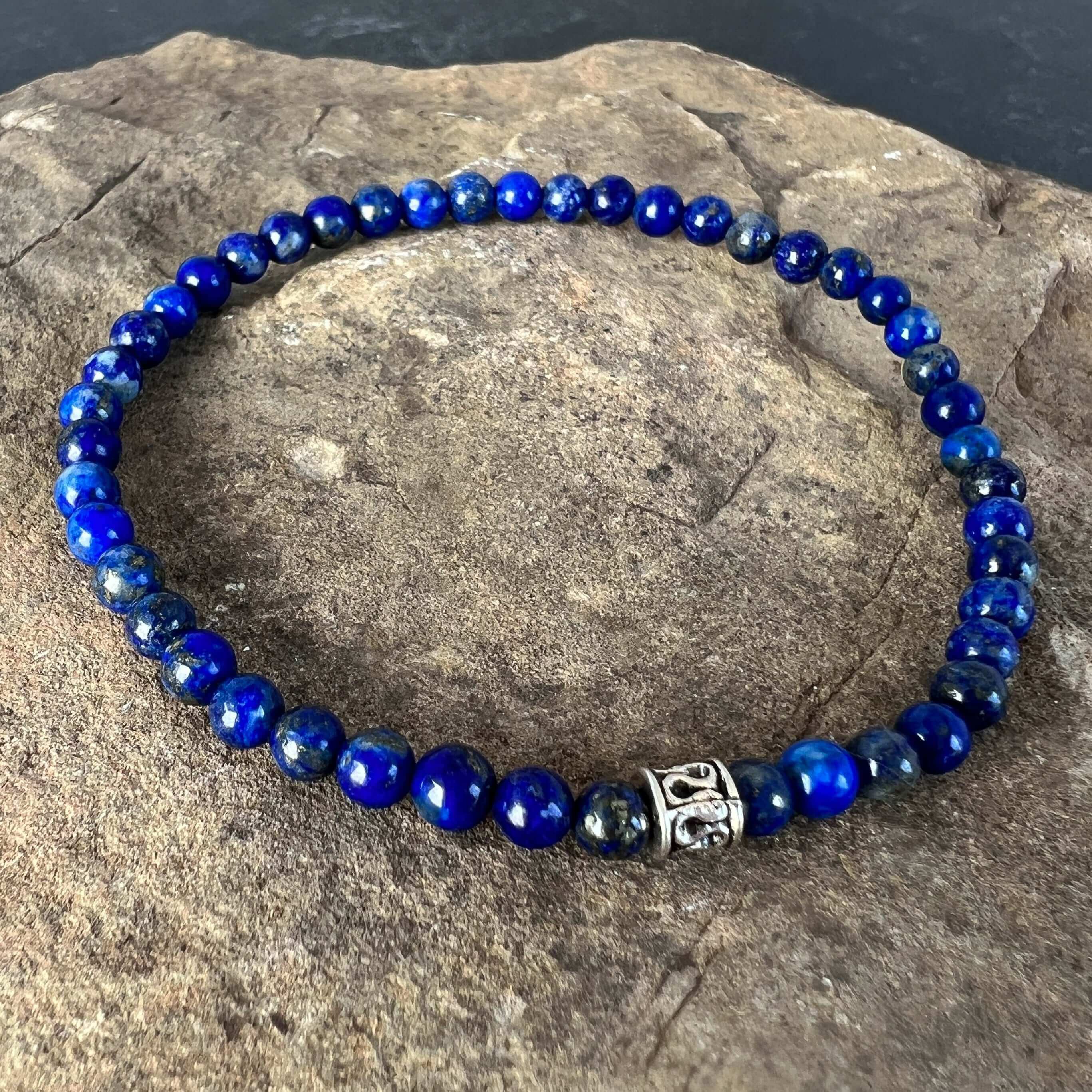 Lapis Lazuli Bead Bracelet This bracelet is made with high-quality Lapis Lazuli stones which bring wisdom to the wearer. Zodiac: Sagittarius and Libra. Chakras: Third Eye, Crown, and Throat. Handmade with authentic crystals & gemstones in Minneapolis, MN.