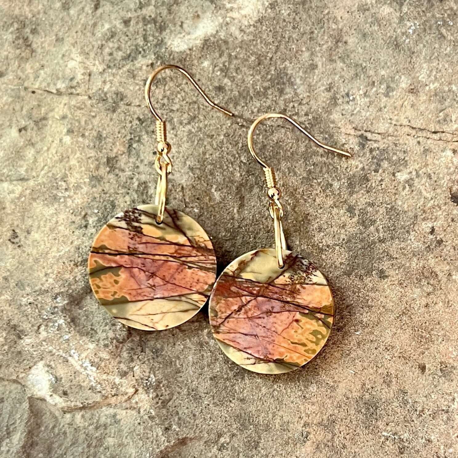 Red Creek Jasper Circle Earrings These earrings are made with high-quality Red Creek Jasper gemstones which bring balancing energy to the wearer. Zodiac Signs: Aries, Scorpio Chakras: Root, Sacral. Handmade with authentic crystals & gemstones in Minneapol