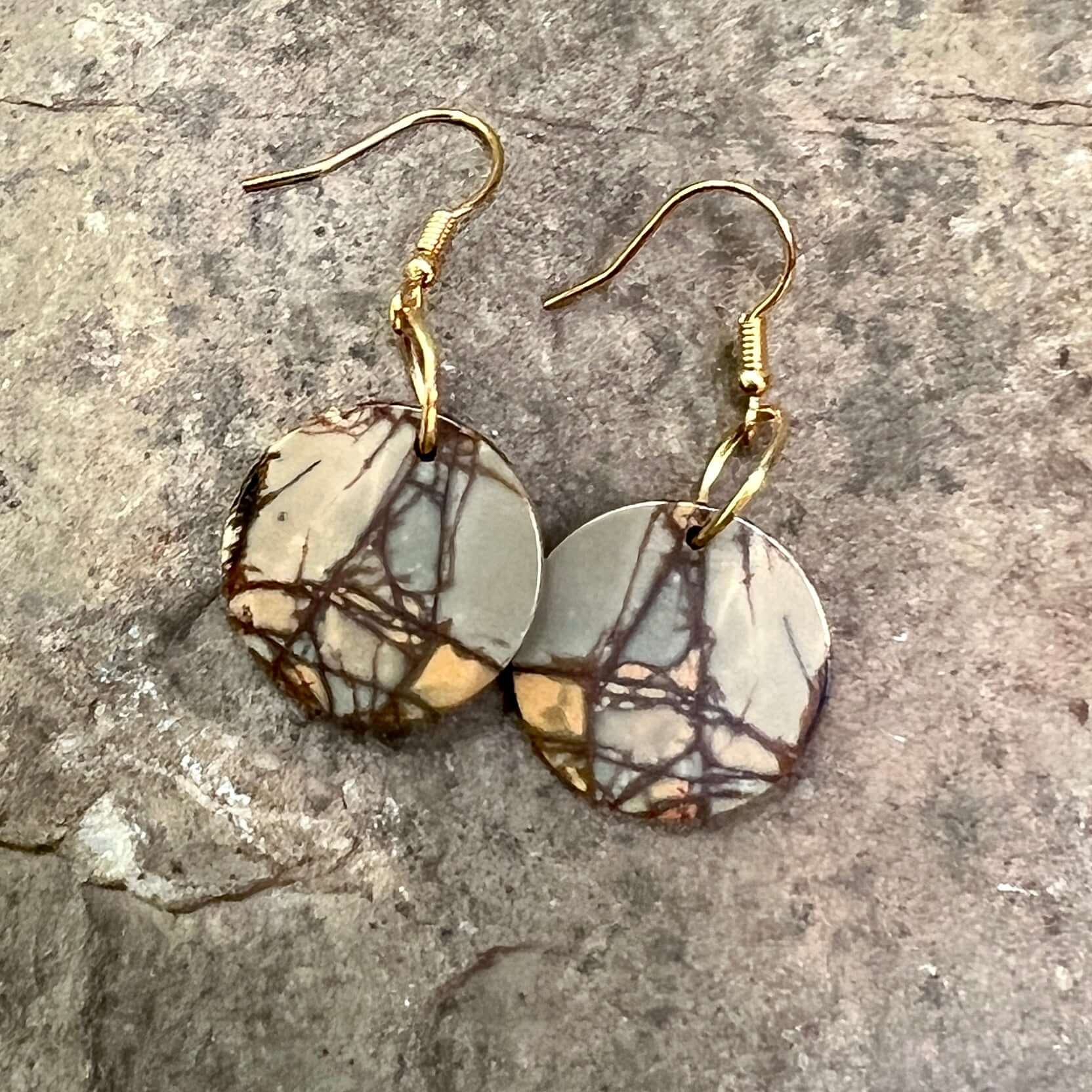 Red Creek Jasper Circle Earrings These earrings are made with high-quality Red Creek Jasper gemstones which bring balancing energy to the wearer. Zodiac Signs: Aries, Scorpio Chakras: Root, Sacral. Handmade with authentic crystals & gemstones in Minneapol