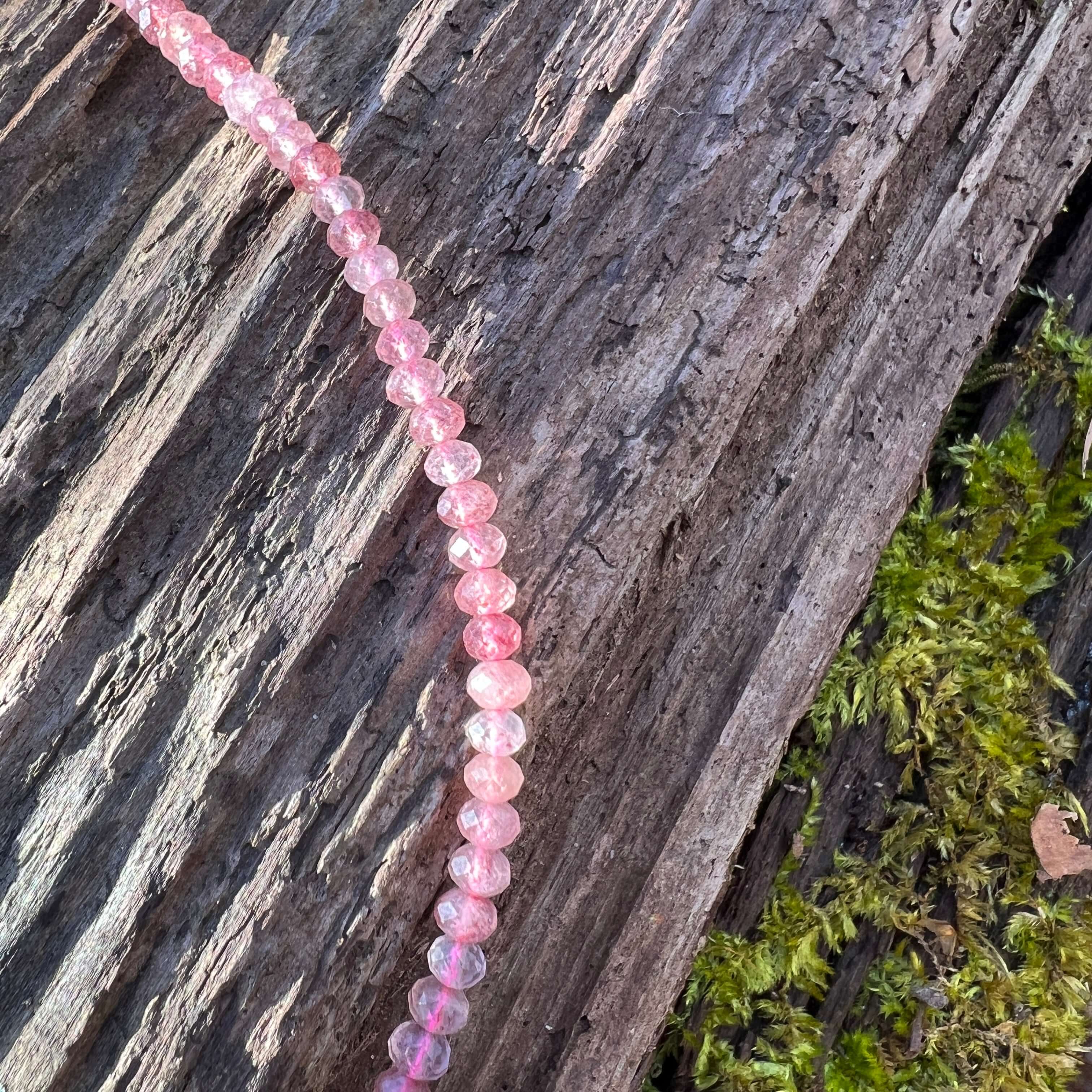 Strawberry Quartz Necklace This necklace is made with high-quality Strawberry Quartz gemstones which bring self-compassion and positive energy to the wearer. This beautiful pink stone is cut in a dainty, faceted rondelle shape which brings a sense feminin