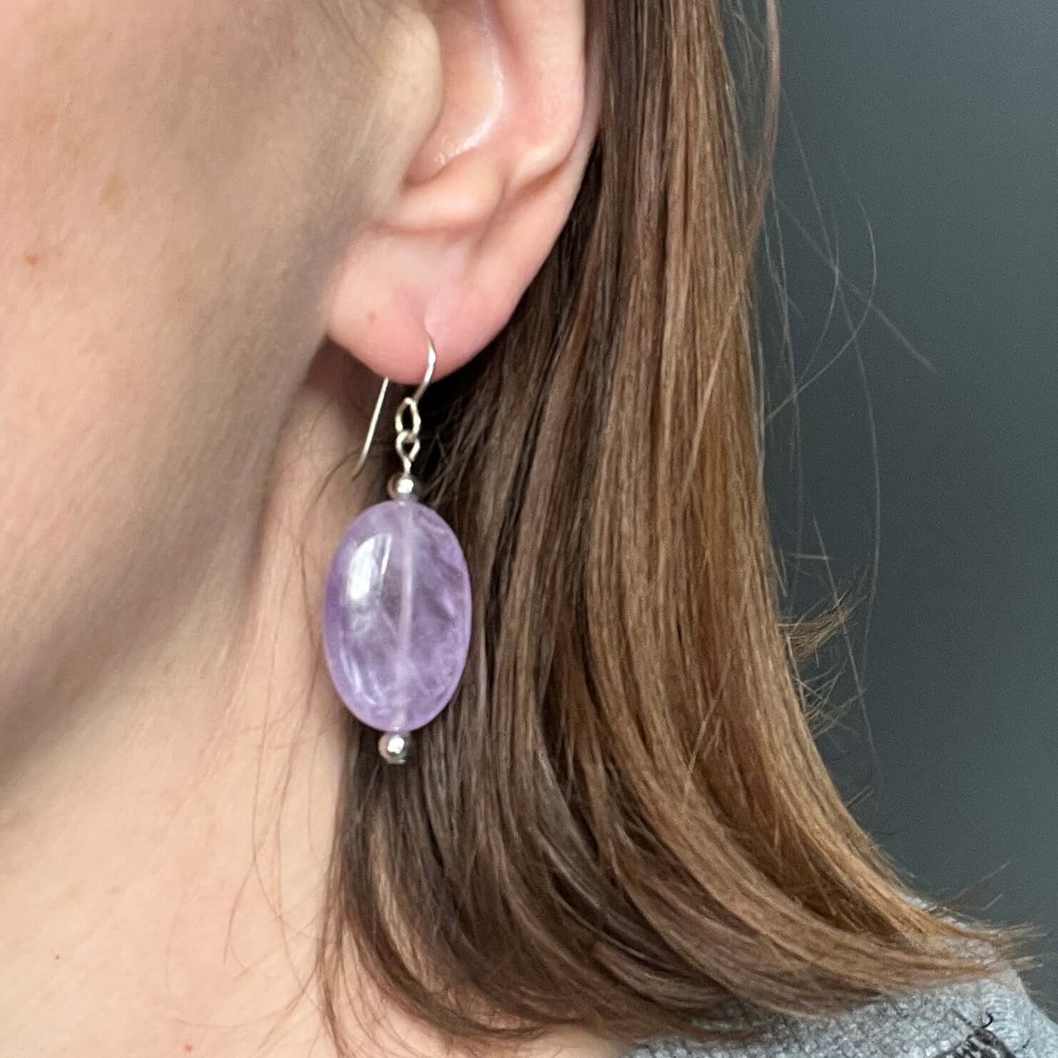 Lavender Amethyst Earrings These earrings are made with high-quality Amethyst stones which bring serenity to the wearer. Amethyst is a stone of serenity. This stone helps to calm the mind. It was once known as a “Gem of Fire” by ancient cultures. It has b