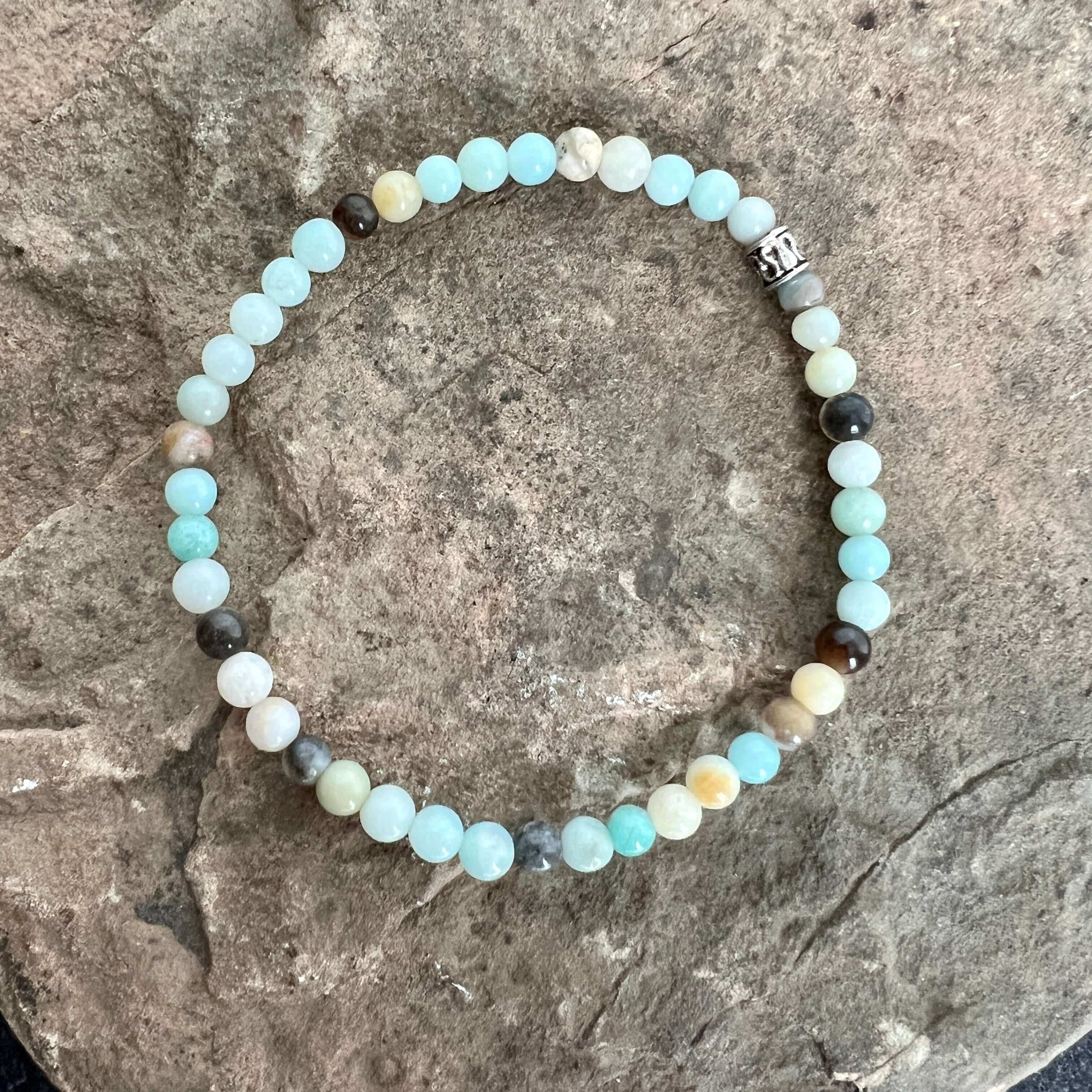 Black Gold Amazonite Bracelet This bracelet is made with high-quality Black Gold Amazonite stones which bring inspiration and calm to the wearer. Zodiac Sign: Virgo. Chakras: Heart and Throat. Handmade with authentic crystals and gemstones in Minneapolis,