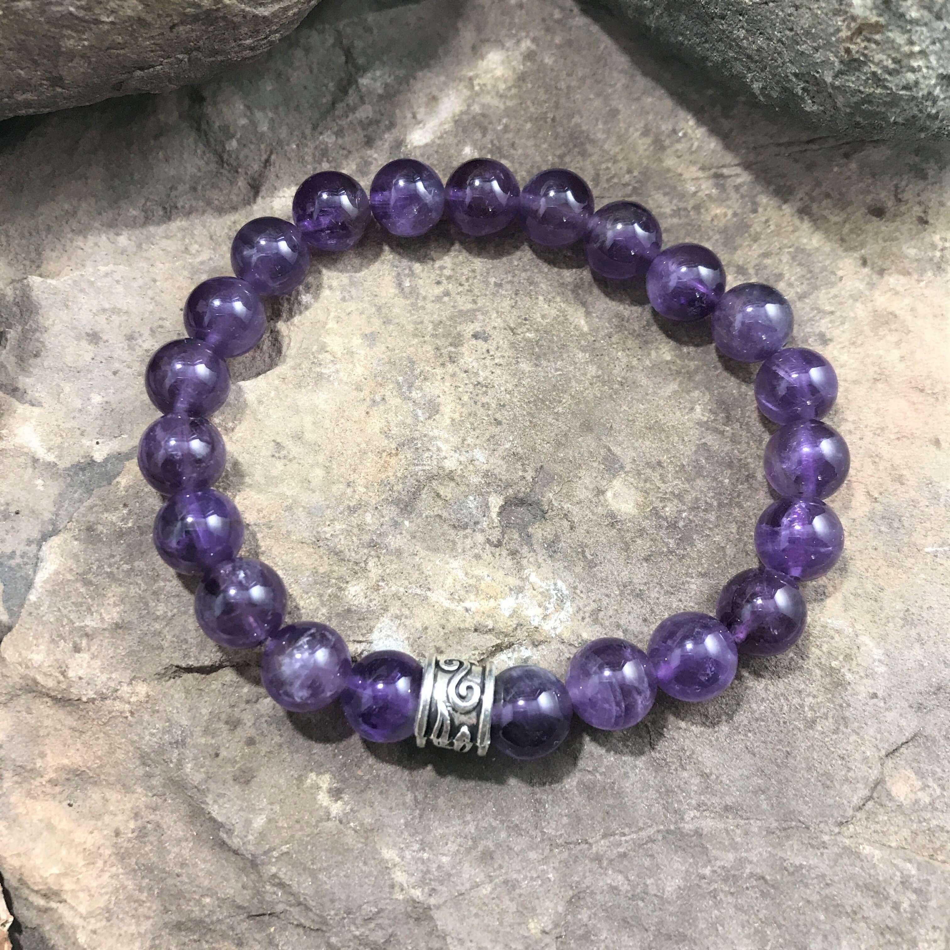 Amethyst Bead Bracelet This bracelet is made with high-quality Amethyst stones which bring serenity to the wearer. Zodiac: Aquarius. Chakras: Third Eye and Crown. Birthstone: February. Handmade with authentic crystals and gemstones in Minneapolis, MN.