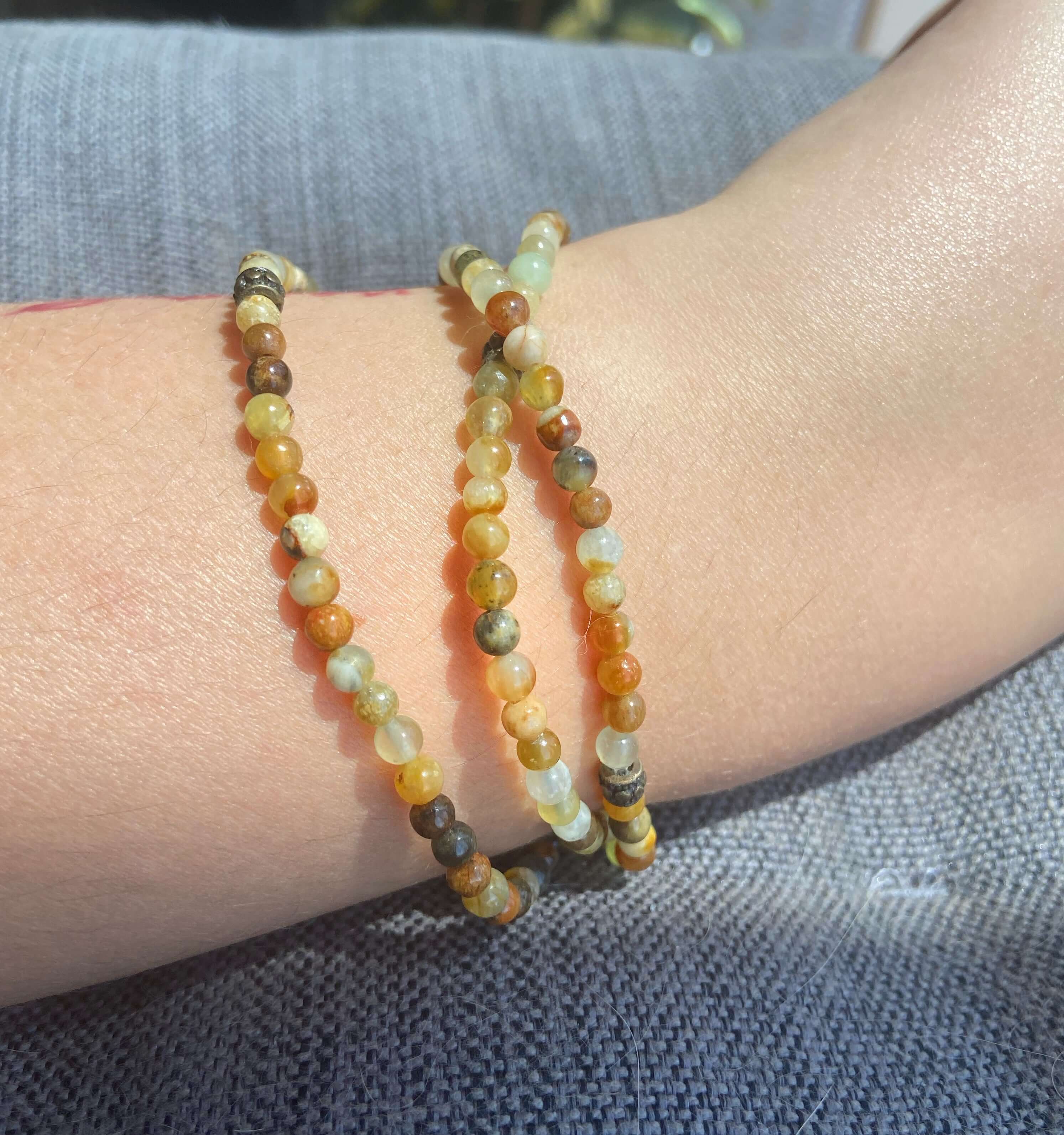 Flower Jade Mini Bead Bracelet This bracelet is made with high-quality Flower Jade stones which bring balance to the wearer. Zodiac Signs: Aries, Taurus, Gemini, and Libra. Chakra: Heart and Solar Plexus. Handmade with authentic crystals and gemstones in