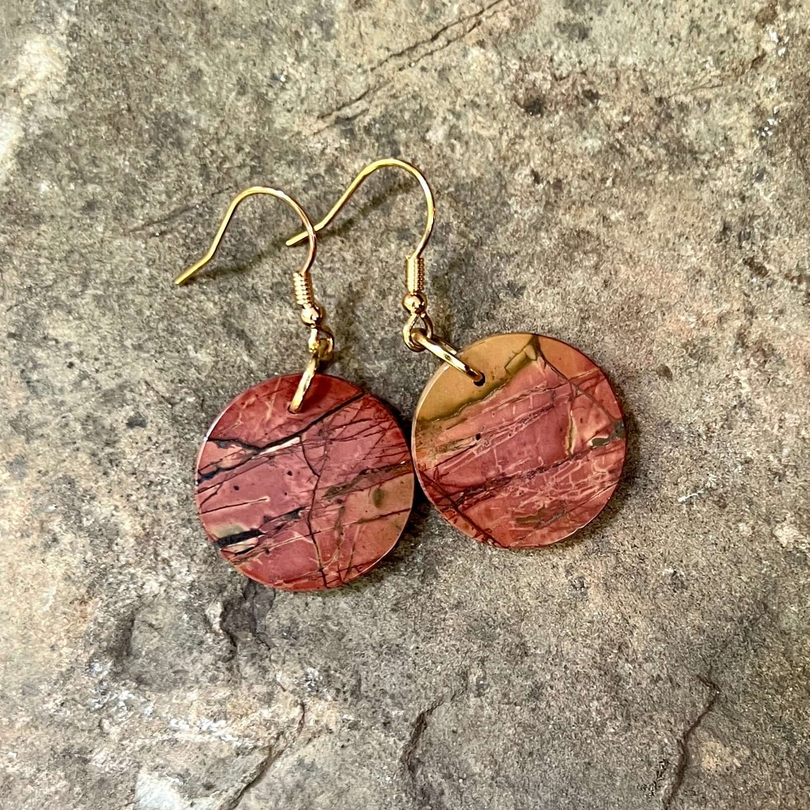 Red Creek Jasper Circle Earrings These earrings are made with high-quality Red Creek Jasper gemstones which bring balancing energy to the wearer. Zodiac Signs: Aries, Scorpio Chakras: Root, Sacral. Handmade with authentic crystals & gemstones in Minneapol