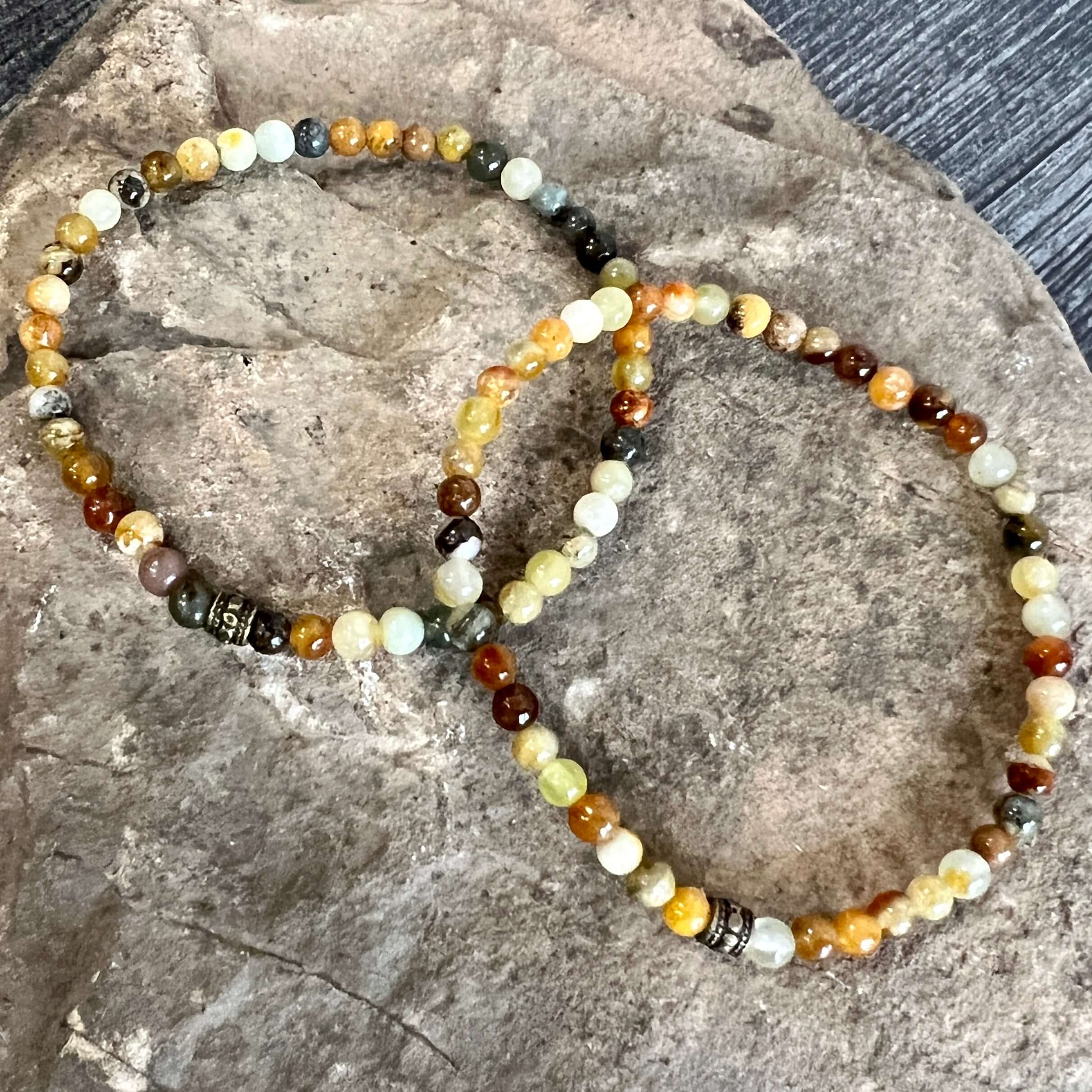 Flower Jade Mini Bead Bracelet This bracelet is made with high-quality Flower Jade stones which bring balance to the wearer. Zodiac Signs: Aries, Taurus, Gemini, and Libra. Chakra: Heart and Solar Plexus. Handmade with authentic crystals and gemstones in