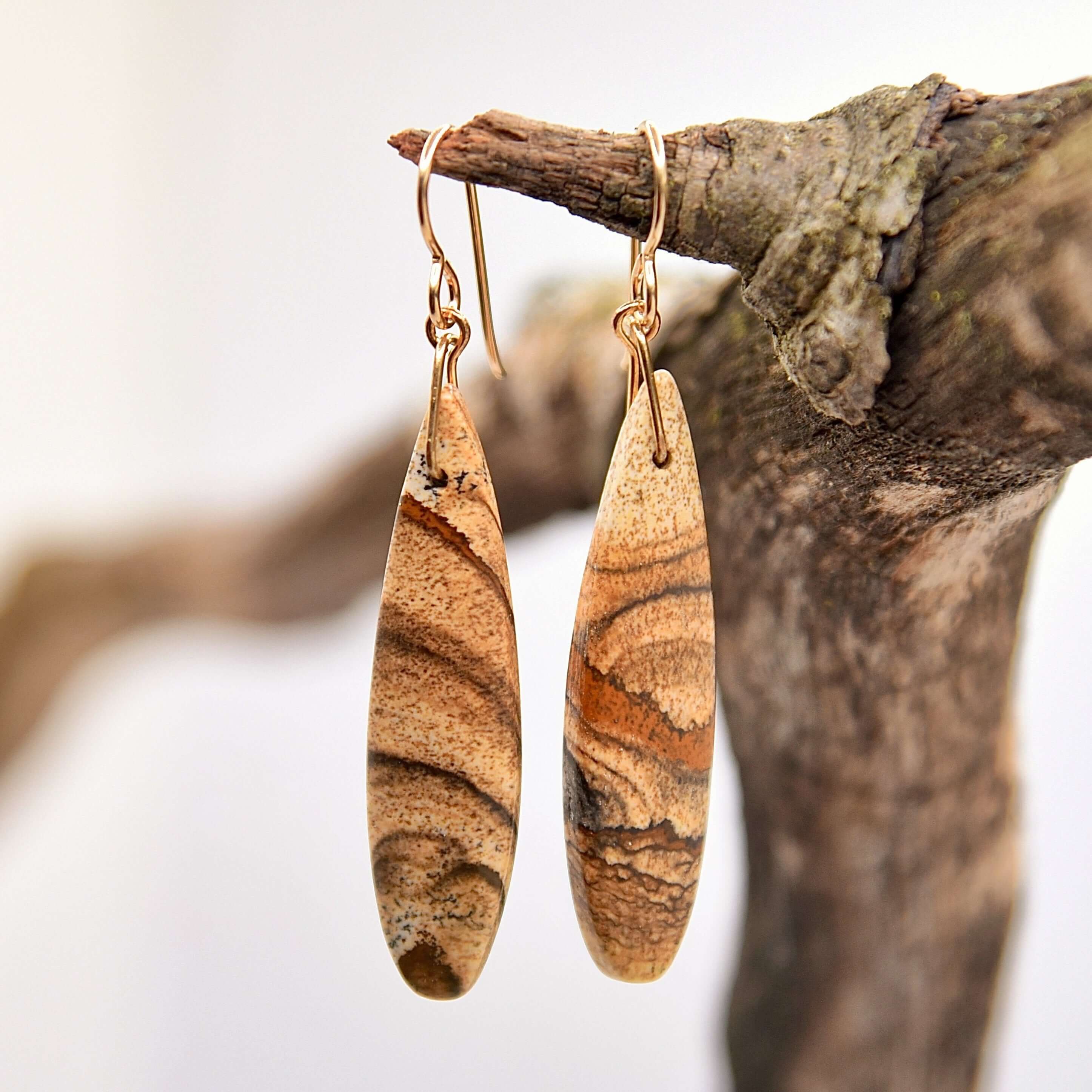 Picture Jasper Earrings These earrings are made with high-quality Picture Jasper gemstones which bring confidence and courage to the wearer. Zodiac Signs: Leo and Capricorn. Chakras: Root and Third Eye. Handmade with authentic crystals & gemstones in Minn