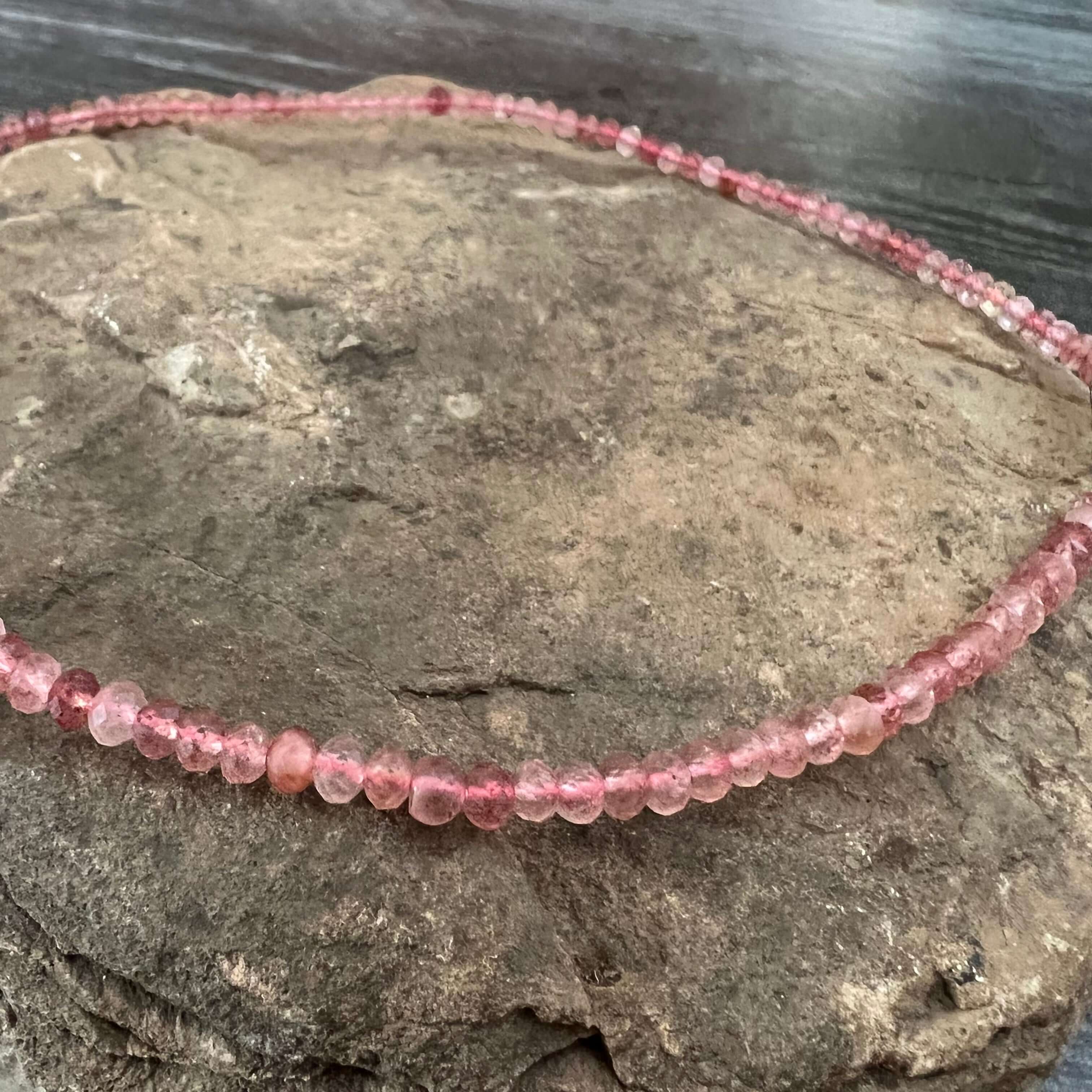 Strawberry Quartz Necklace This necklace is made with high-quality Strawberry Quartz gemstones which bring self-compassion and positive energy to the wearer. This beautiful pink stone is cut in a dainty, faceted rondelle shape which brings a sense feminin