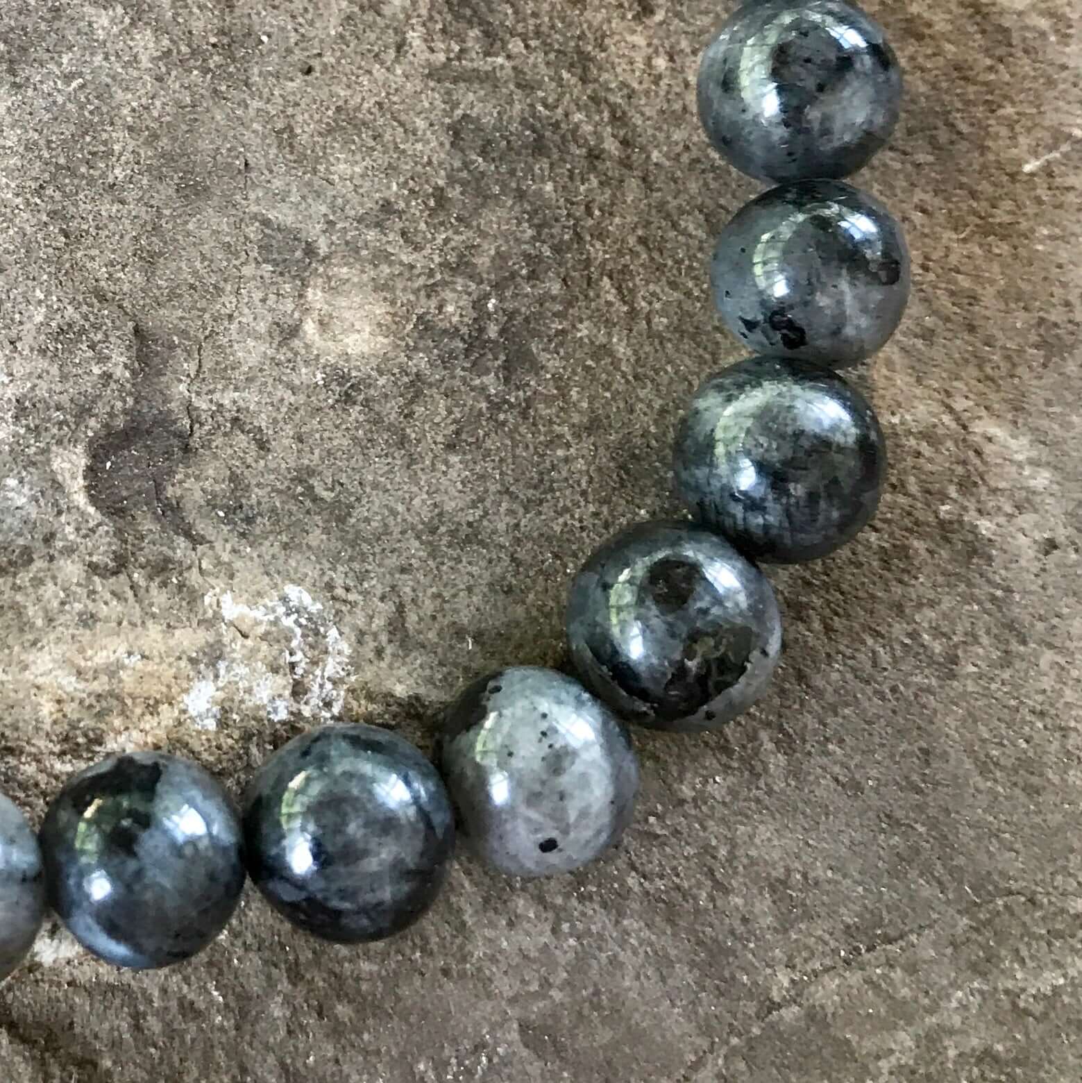 Larvikite Bracelet This bracelet is made with high-quality Larvikite stones which bring protection and a strong connection to nature to the wearer. Zodiac Signs: Aquarius. Chakras: Root and Third Eye. Handmade with authentic crystals & gemstones in Minnea