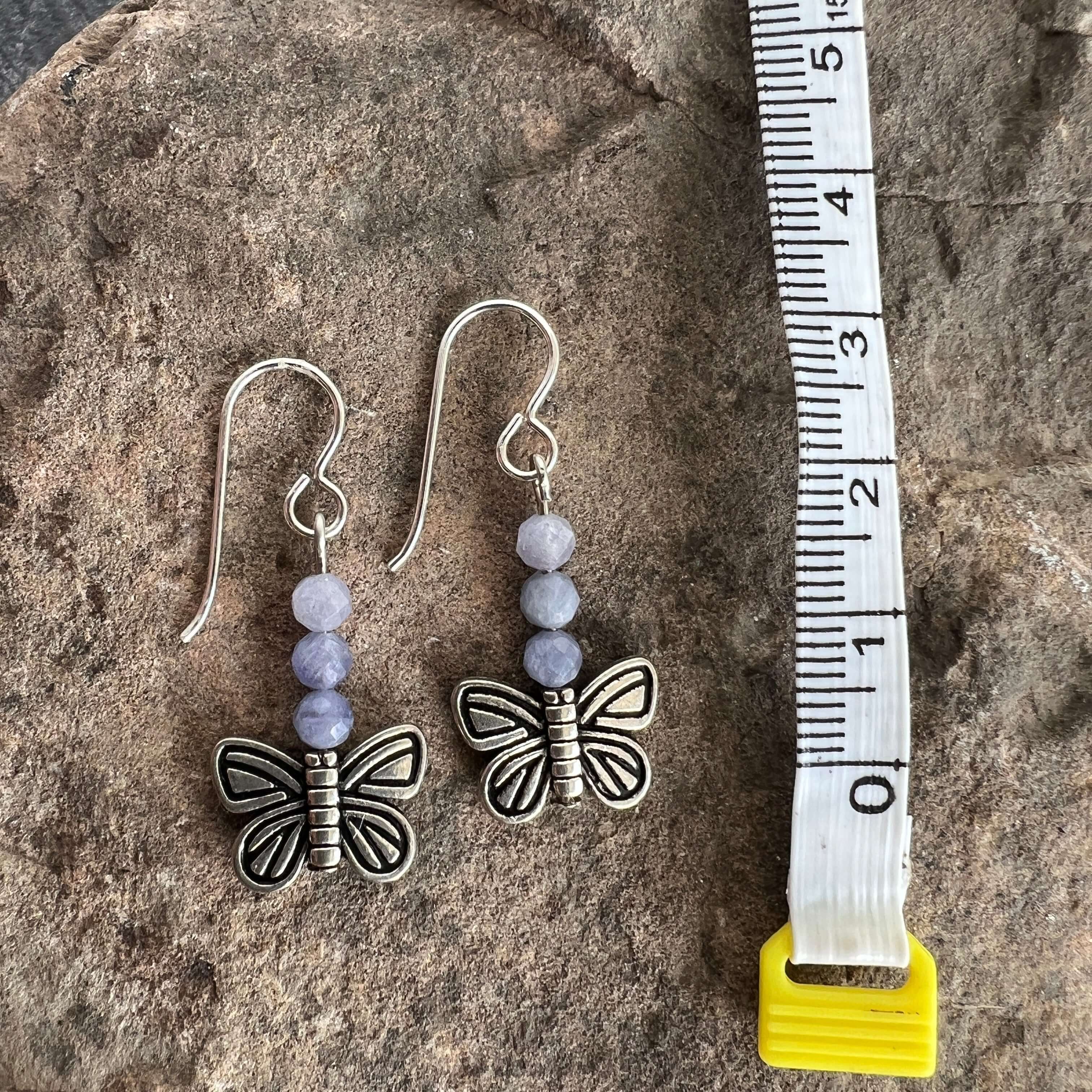 Devon's Butterfly Earrings These earrings are made with genuine Tanzanite stones with a pewter Butterfly. All profits from the sale of these earrings will be donated to the Pediatric Heart Program at Children's Hospital MN in memory of Devon Jenson, the h