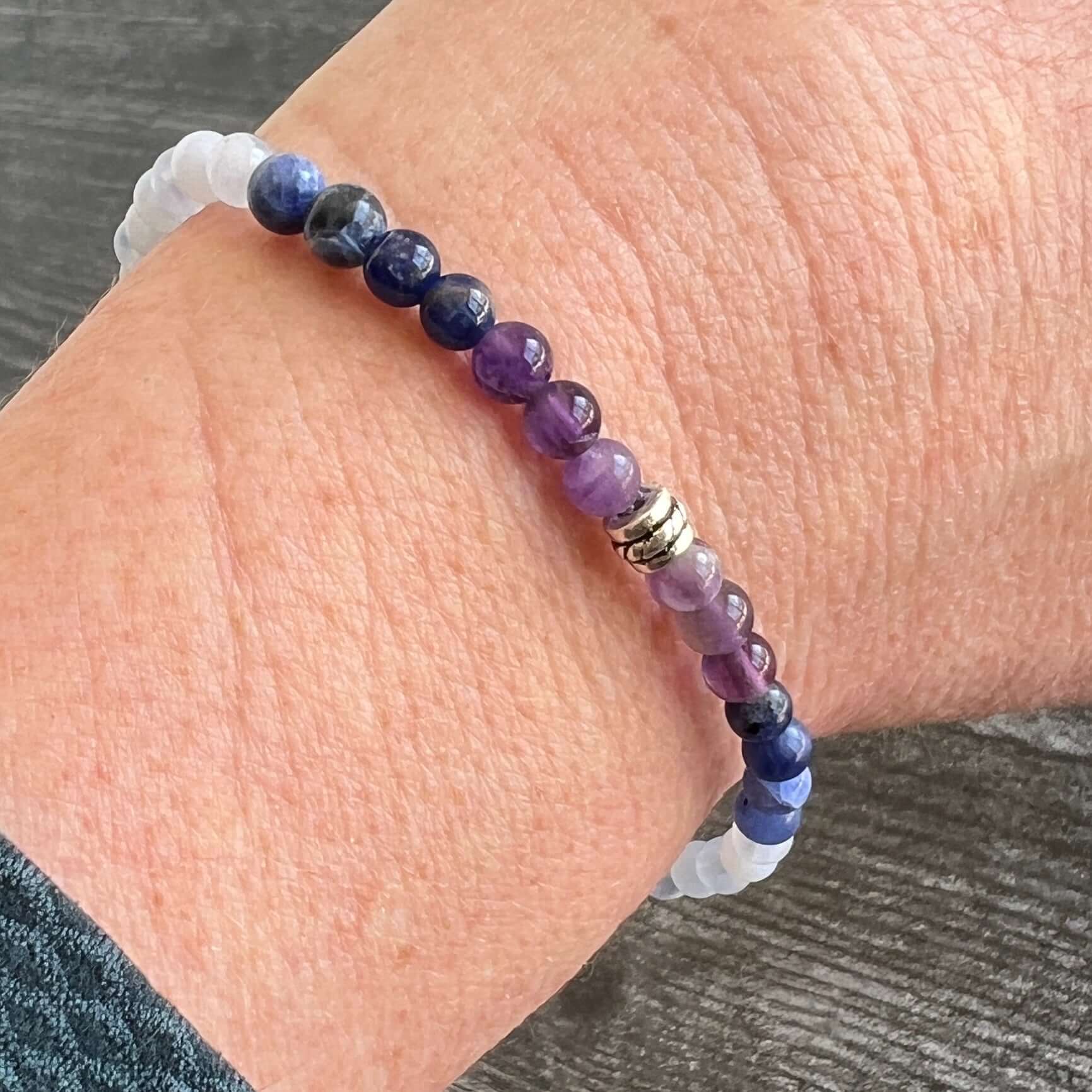 Twilight Bracelet This bracelet is made with Amethyst, Sodalite, and Blue Lake Agate which can heighten intuition and assist you to think logically and speak with clarity.