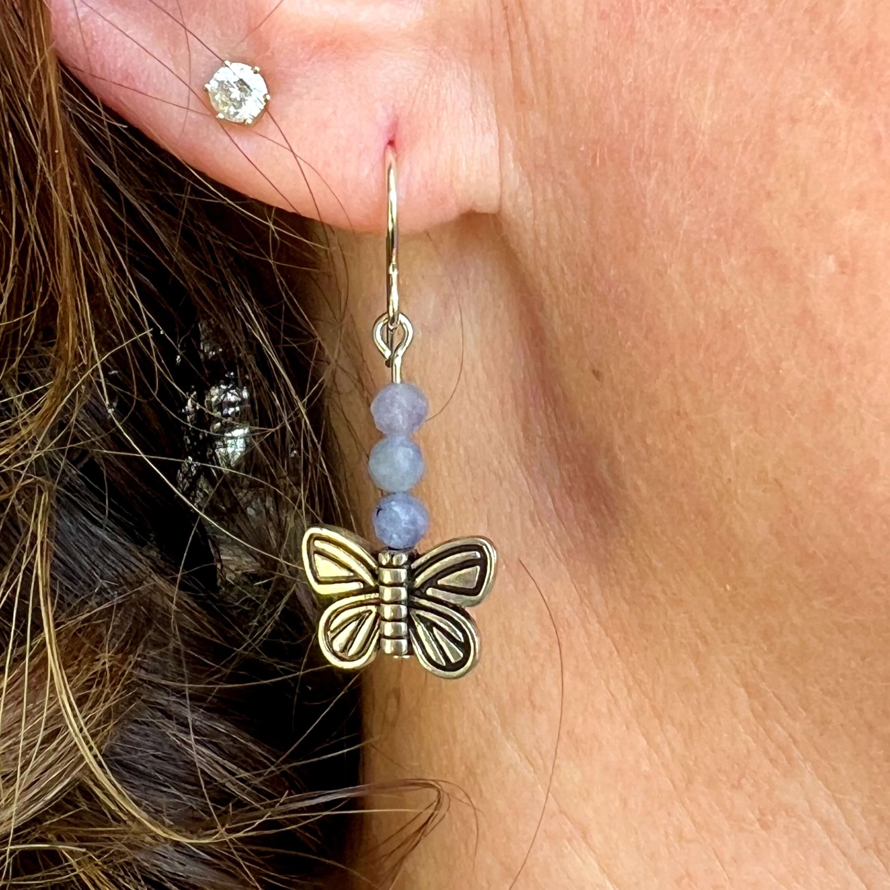 Devon's Butterfly Earrings These earrings are made with genuine Tanzanite stones with a pewter Butterfly. All profits from the sale of these earrings will be donated to the Pediatric Heart Program at Children's Hospital MN in memory of Devon Jenson, the h