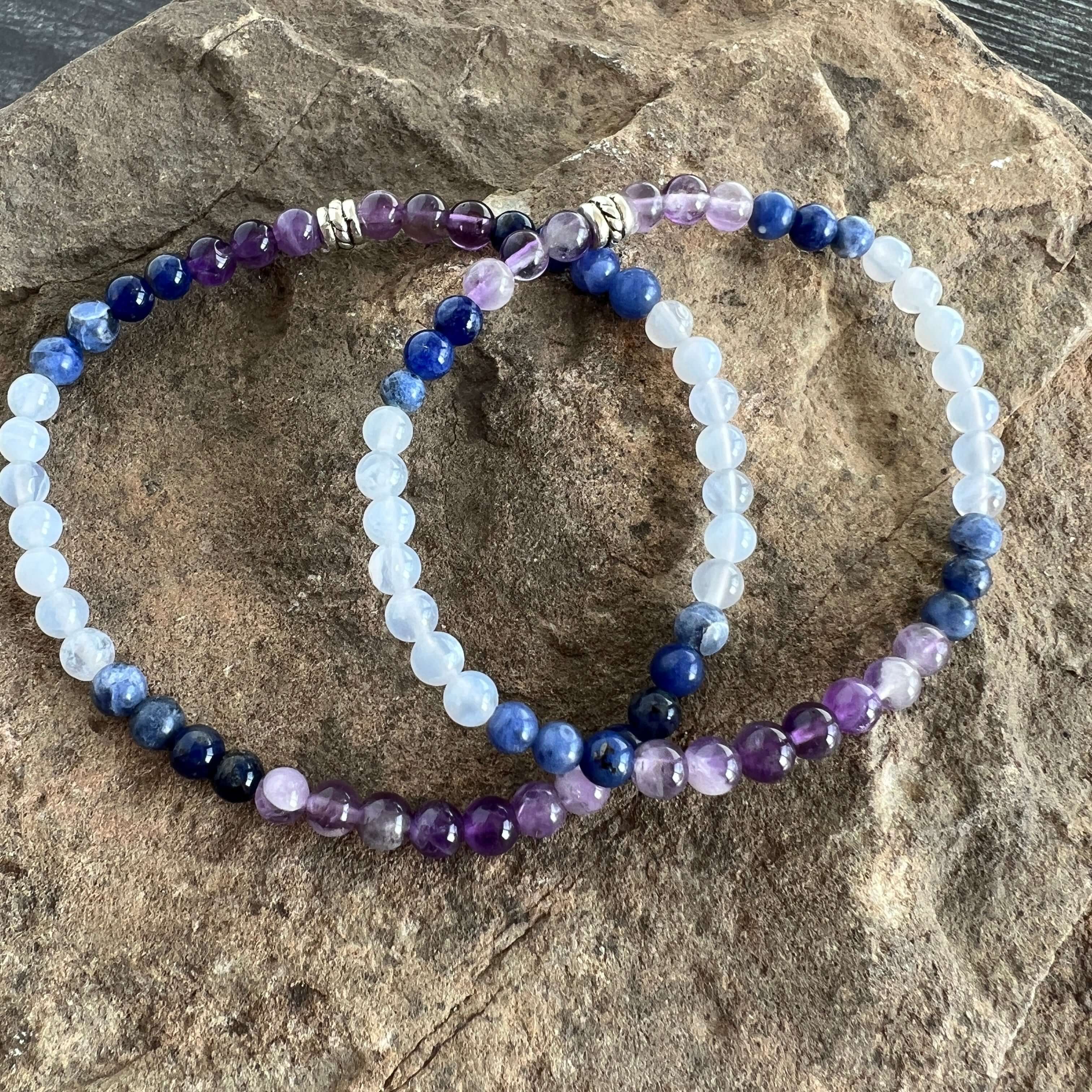 Twilight Bracelet This bracelet is made with Amethyst, Sodalite, and Blue Lake Agate which can heighten intuition and assist you to think logically and speak with clarity.